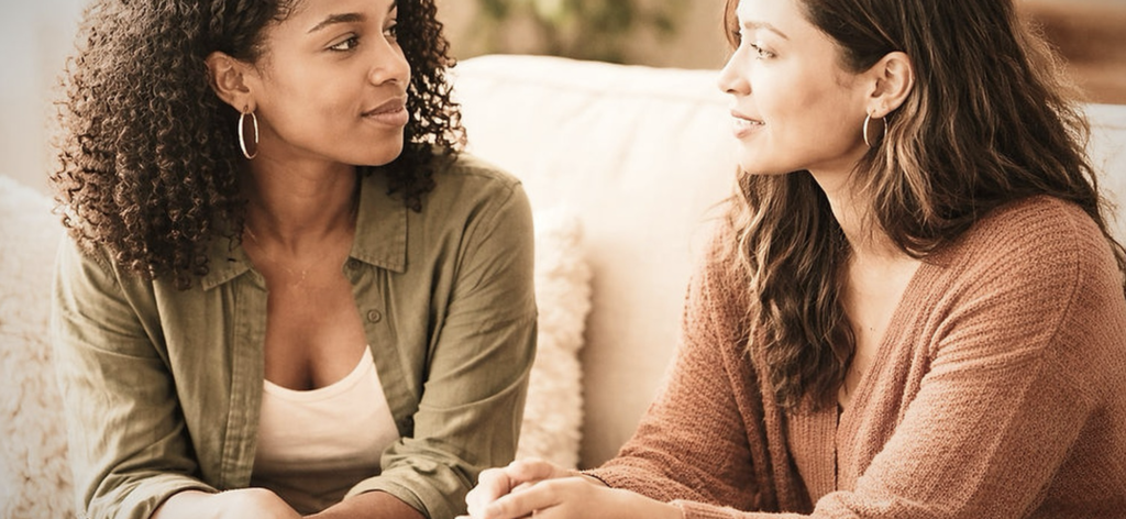 Friends having a supportive conversation that promotes emotional well-being.